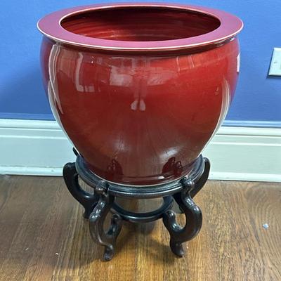 Chinese Oxblood-Colored Fishbowl - 1/2 | Chinese oxblood/deep red porcelain fishbowl/cachepot with wooden stand. Stand: h. 8”. Cachepot:...