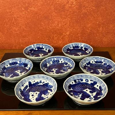 (7pc) Chinese Porcelain Bowls - Koi Fish | Chinese blue and white porcelain bowls featuring a koi fish motif. - h. 1.5 x w. 6 in
