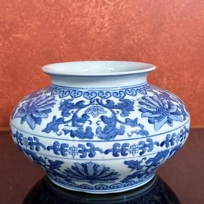 Chinese Porcelain Cachepot - Blue | Chinese white porcelain cachepot with blue floral details. After the pottery style of the Yuan...