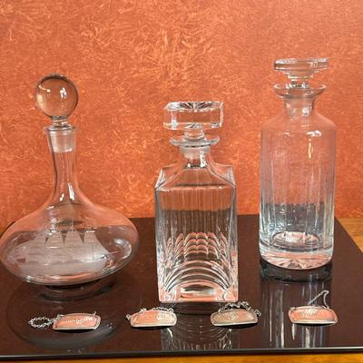(7pc) Crystal Decanters & Silver Labels | Collection of crystal decanters and silver labels: Vintage (mid 20th c.) Romanian...