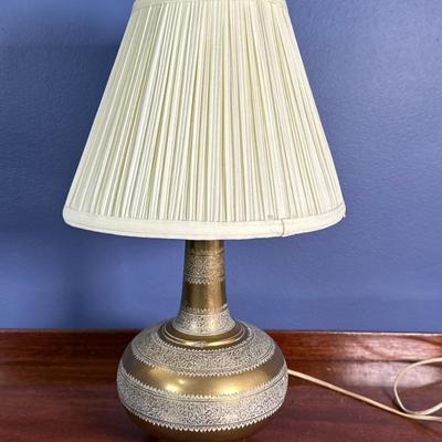 Middle Eastern Brass Table Lamp | Middle Eastern inspired brass table lamp with etched details and small pleated lampshade. - h. 17 x w....
