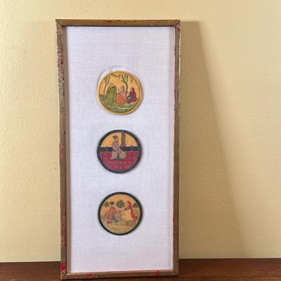 Indian Folk Art/Paintings | Indian folk art/paintings on round disks, framed together in a gold painted frame. - h. 21 x w. 9.5 in
