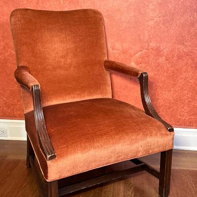 George III Style Rust Colored Velvet Armchair | Vintage George III style mahogany carved library armchair with rust-colored velvet...