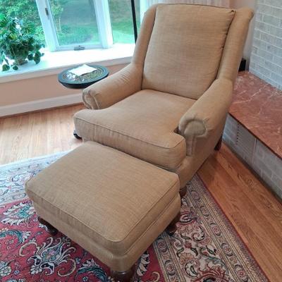 Linen covered armchair and ottoman