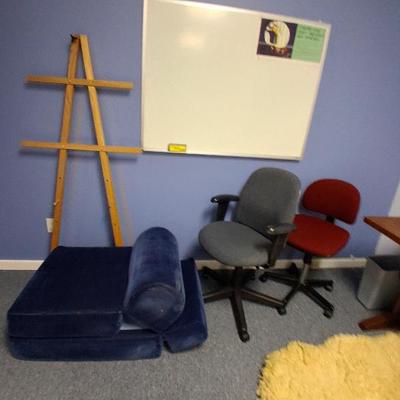 easel, floor mattress, white board