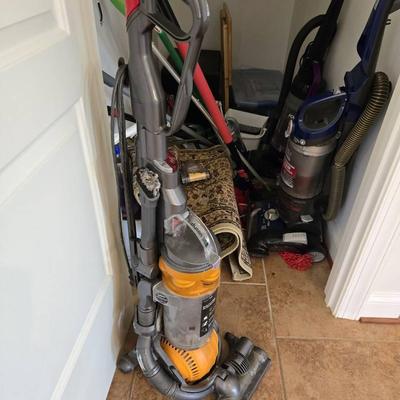 Hall Closet Lot: Vacuums, Cleaning Tools, DVDs