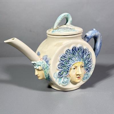 Unique Pitcher | Woman with blue handle and blue headwear. Marked on the bottom. - h. 7 x w. 9 in
