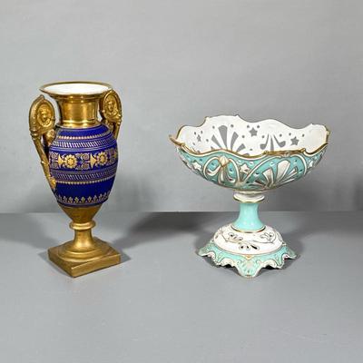 (2pc) Vase And Fruit Basket | Tall porcelain empire style vase with gilded design over dark blue. Porcelain openwork pedestal basket has...