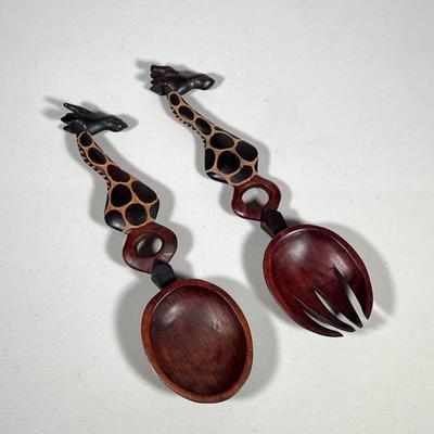 (2pc) WOODEN GIRAFFE SALAD SPOONS | Set of carved wood giraffe form salad spoons. Dimensions: w. 3.75 x l. 14 in
