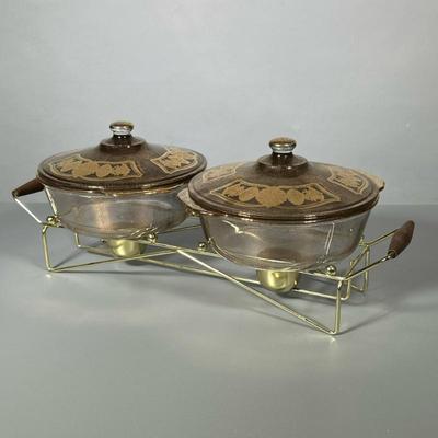FIRE-KING DOUBLE STERNO SET | Pair of gilt & glass lidded bowls with sterno mount - h. 8 x w. 10 x l. 21.25 mm
