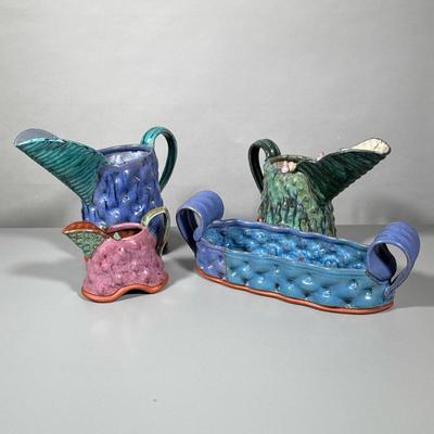 (4pc) Collection Of Art Pottery Signed | Including 3 pitchers and a planter Signed Flyn - h. 10 x w. 4 x l. 13 x d. 4 in (large pitcher)
