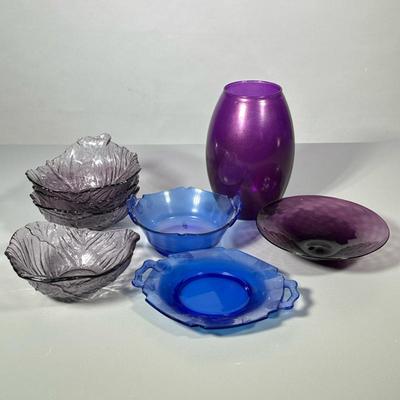 (8pc) MIXED COLORED GLASS DISHES | Including: purple glass vase, blown purple glass bowl, 4 purple cabbage form bowls, and 2 blue glass...