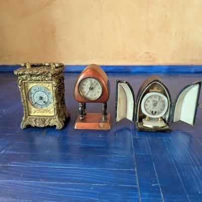 Lot #155 - Antique Miniature Carriage Clock, Mid Century Triangular Pedestal Clock, Bevet Brass & MOP Cased Travel Clock