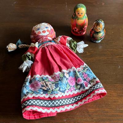 Lot #162 - Vintage Russian Cloth Folk Art Doll and Two Matryoshka Doll Sets