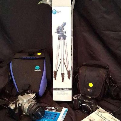 One Minolta Film Camera And Digital Canon Camera And Tripod