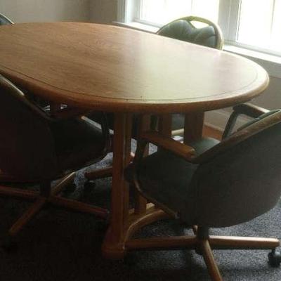 Oak Colored Table And Four Chairs 