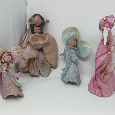 Fanciful Wall Hanging Statues