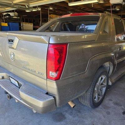 #100 • 2003 Cadillac Escalade EXT
