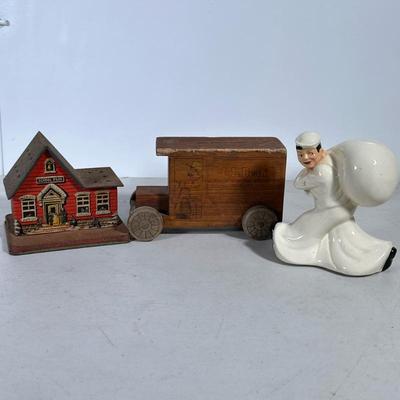 (3pc) MIXED COIN BANKS | Including: painted tin schoolhouse bank, L.L. Bean wood boxcar bank, and ceramic bank - h. 4 x w. 3.5 x l. 7 in...