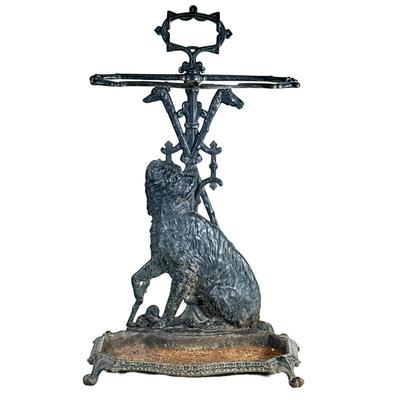 CAST IRON UMBRELLA STAND | Umbrella or cane stand decorated with a seated terrier dog and crossed walking sticks - h. 25.5 x w. 15.5 x d....
