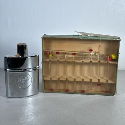 (2pc) Flask And Stirrers | Flask originally filled with Wild Turkey Wiskey, collection of glass cocktail stirrers. - h. 7 x w. 4.5 in...