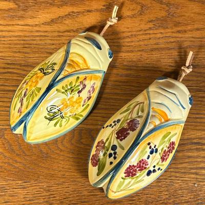 (2pc) PAIR CERAMIC CRICKETS | Pair of glazed ceramic decorative crickets or cicadas, decorated with flowers, signed on back - h. 6.5 x w....