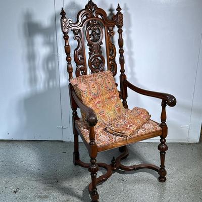 BAROQUE STYLE FANCY CARVED ARMCHAIR | English 19th century Baroque; walnut. Comes with matching pillows and blanket - h. 52 x w. 26.5 x...