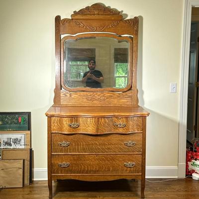 CARVED WOOD DRESSER & MIRROR | Carved wood dresser with attached mirror having carved finial over 2 split width drawers over 2 full...