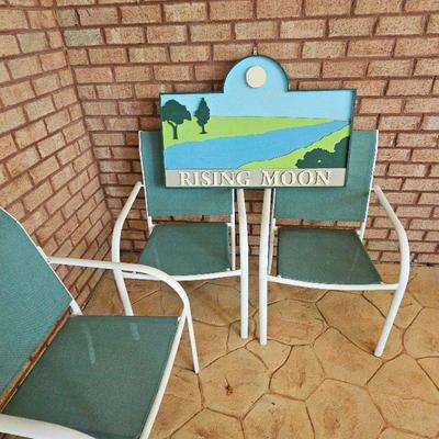 3 Patio Chairs And A Sign