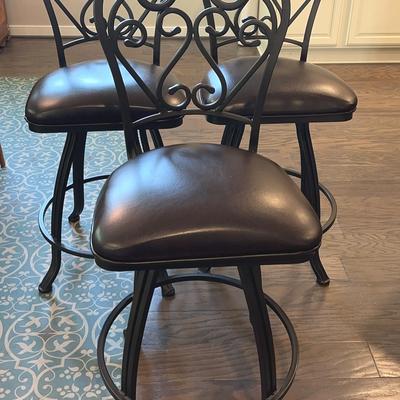 Three Counter Height Swivel Barstools