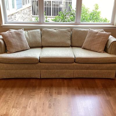Cream Colored Sofa With Two Cushions