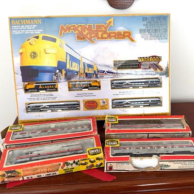 Electric Train Set Along With Four Lifelike Amtrak Train Pieces