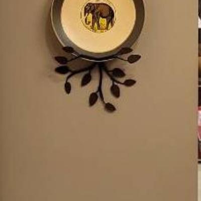 Wall Display of Three Decorative Plates and Seated Lion Sculpture