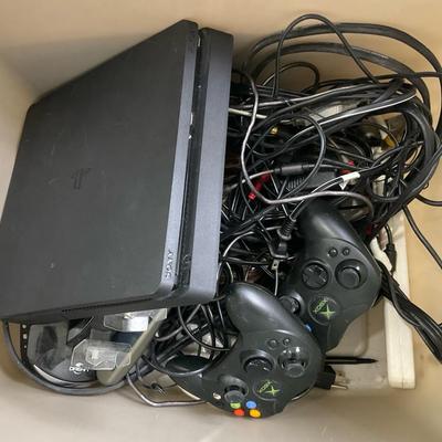 Playstation 3 console with mixed lot of variety of remotes, games and more.