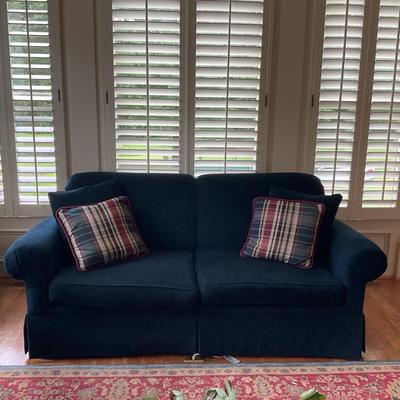 Dark Blue Loveseat with Plaid Accent Pillows