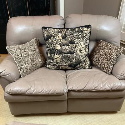 Gray Leather Loveseat with Animal Print Accent Pillows