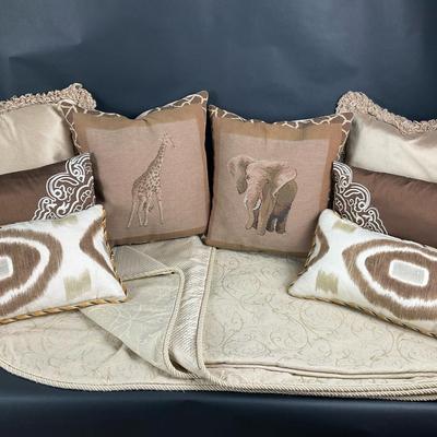 Decorative Throw Pillows and Neutral Blanket