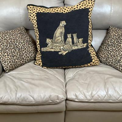 Animal Print Throw Pillows on Leather Sofa