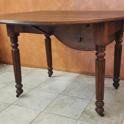 Dark Wood Stain Drop Leaf Table on Castors 