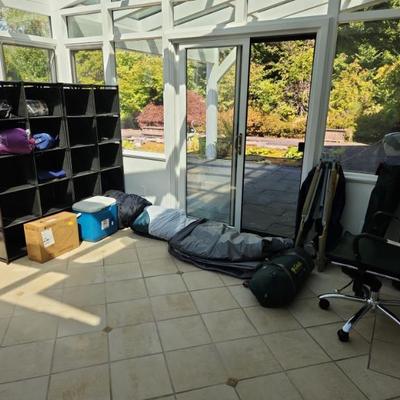 Camping equipment: tent, chairs, sleeping bags, cooler