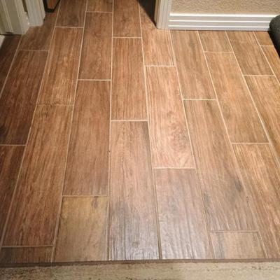 Client has 12 boxes of laminate wood floor material