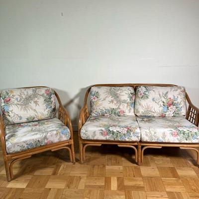 (2pc) Bamboo/Rattan Armchair & Loveseat | Vintage (mid 20th c.) bamboo and rattan armchair and two-cushion loveseat with floral...