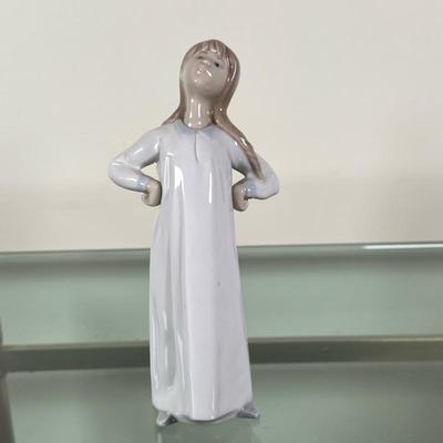 Llardro Figurine - "Girl Stretching" | Lladro figurine, titled "Girl Stretching" (#4872). - h. 8 x w. 3 in