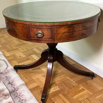 Georgian Style Mahogany Drum Table | Vintage (mid 20th c.) Georgian style mahogany drum table, with tooled leather top, fitted glass, and...