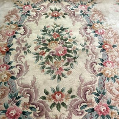 Area Rug with Floral Details | Heavy area rug, approximately 10' x 14.5' (large), with floral details in center and along...