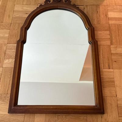 Cherrywood Frame Wall Mirror | Vintage (mid 20th c.) cherrywood frame wall mirror with carved flourish at top. - h. 33 x w. 21 in
