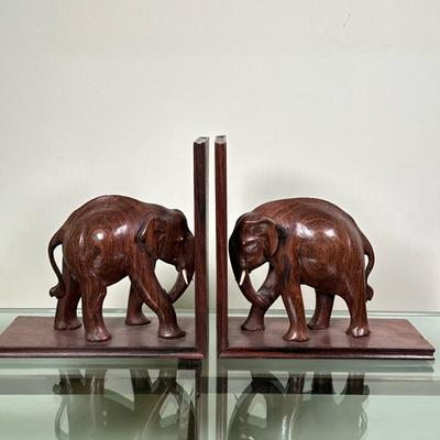(2pc) Carved Rosewood African Elephant Bookends | Pair of vintage (mid-20th c.) hand-carved rosewood African elephant bookends. - h. 9 x...