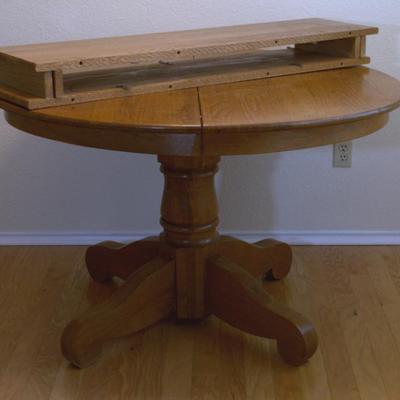 48" solid oak table with two leaves. Without chairs -$250, with chairs, $325