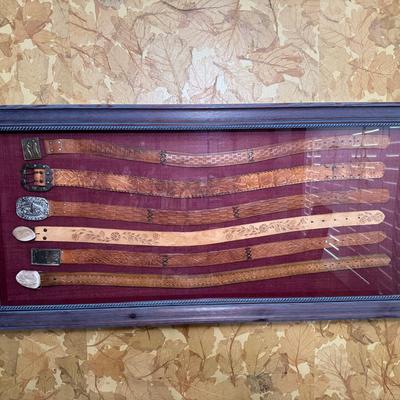 Framed Western Belt Display | Tooled Leather Belts with Buckles, Antler Tips & Silver Accents