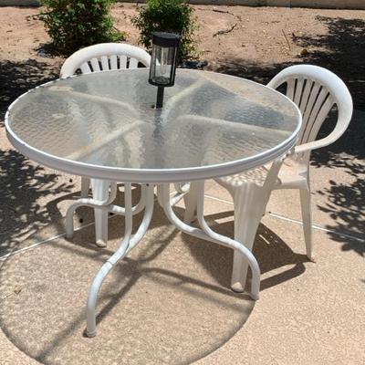 Glass Table And Plastic Chairs